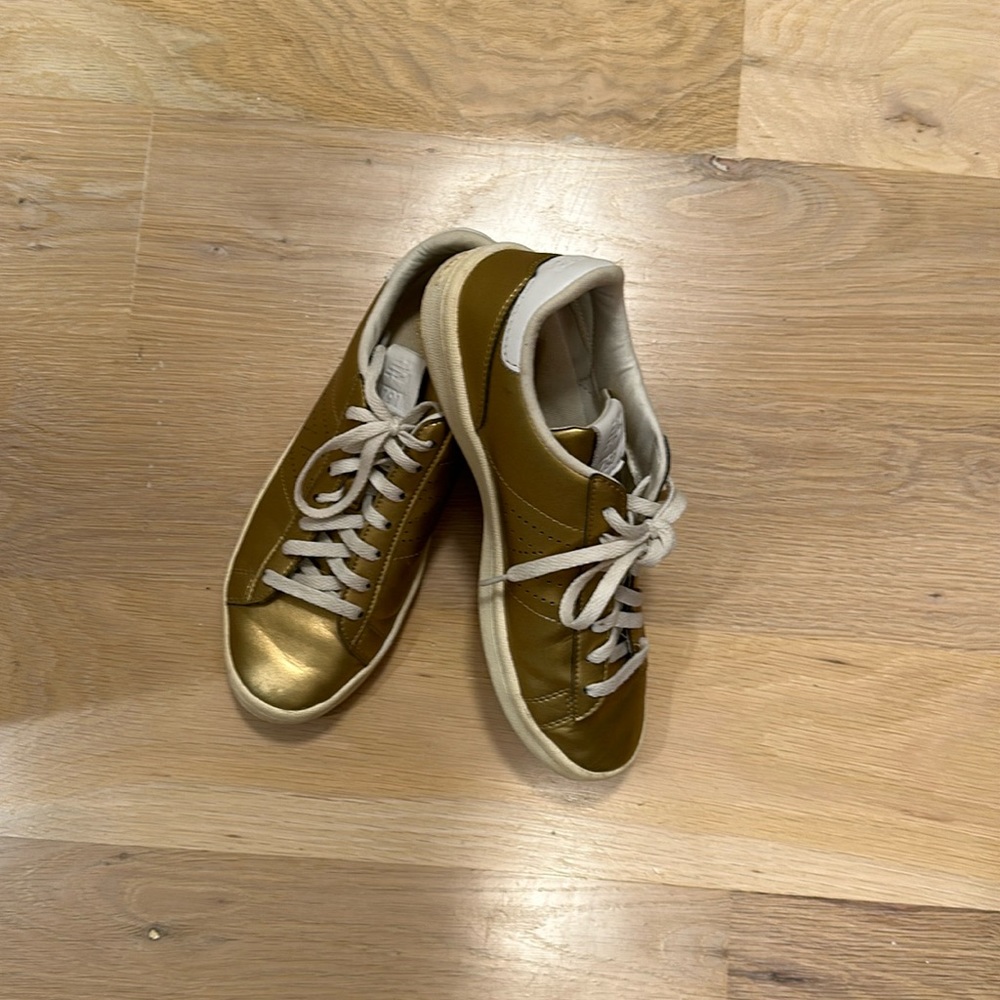 Dusty gold leather sneakers. Perforated cutout N for new balance.